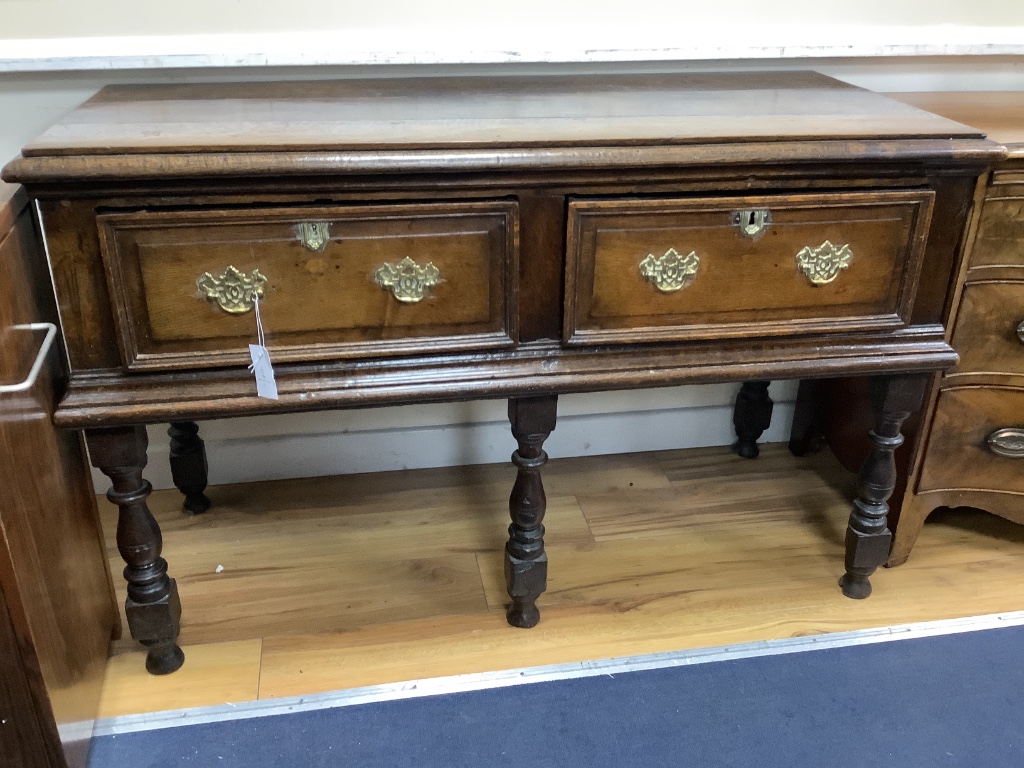 A small 18th century oak two drawer low dresser, width 124cm depth 56cm height 79cm